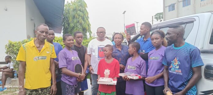 Orok Duke with the athletes on Monday